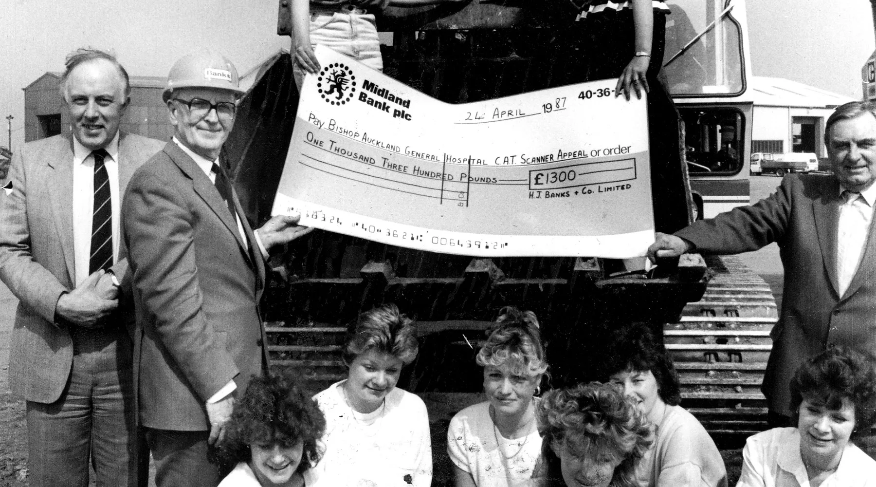 People holding large cheque