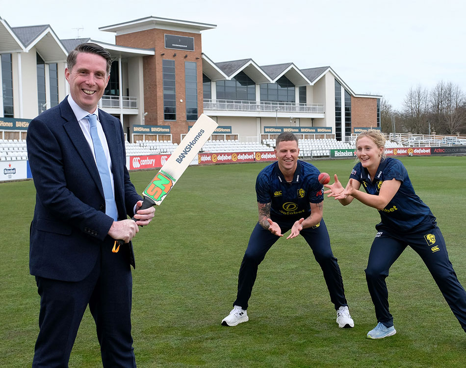 Durham Cricket players Lizzie Scott and Brydon Carse with Russ Hall, managing director of Banks Homes and Banks Property