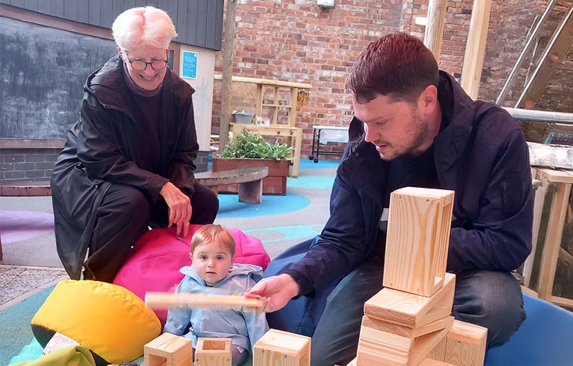 Young Theatre Hullabaloo visitor Arthur and his dad Charlie with Kate Culverhouse of the Banks Group