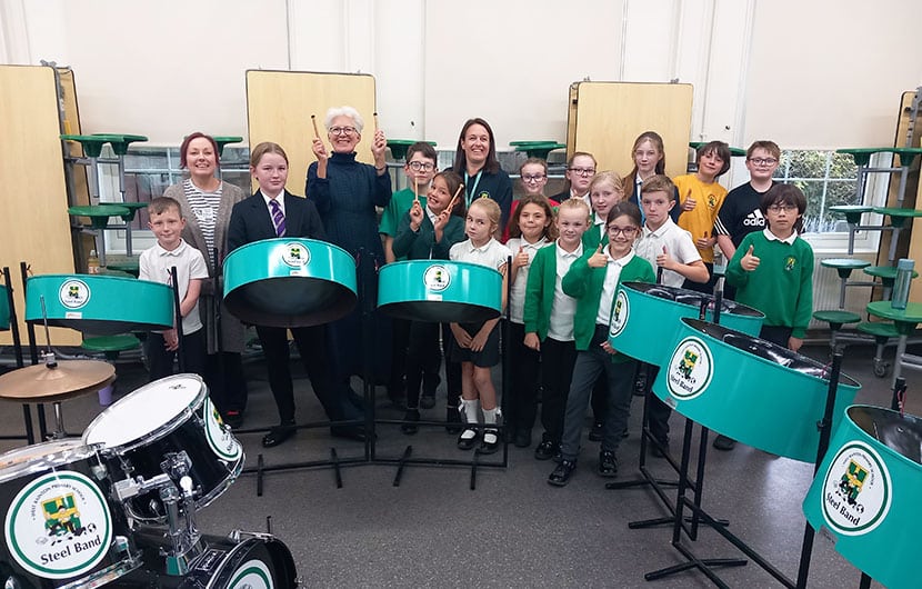 Members of the West Rainton Primary School steel band, along with (back, from left) Holly Fagan of Durham Music Service, Kate Culverhouse of the Banks Group and Alison McDonough, headteacher at West Rainton Primary School