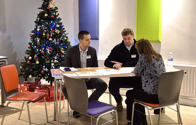 Members of the Banks Homes project team speaking to a visitor to the Sedgefield exhibition