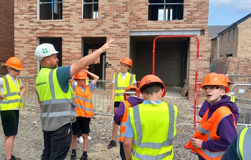 Banks Homes site manager Steve Graham showing the Yarm Primary School pupils around The Cornfields