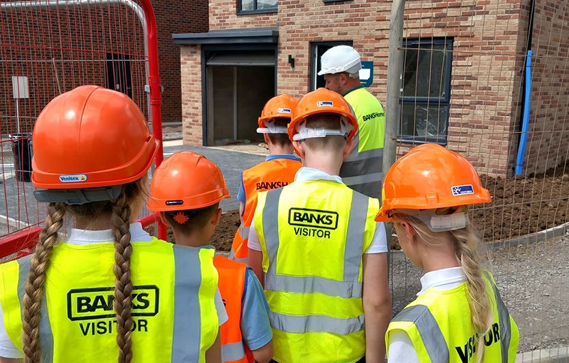 Banks Homes site manager Steve Graham showing the Yarm Primary School pupils around The Cornfields