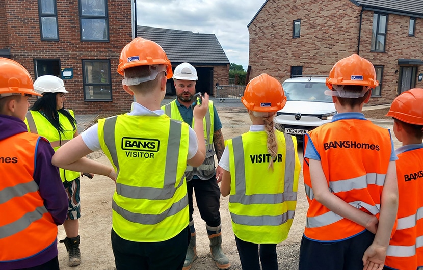 Banks Homes site manager Steve Graham showing the Yarm Primary School pupils around The Cornfields