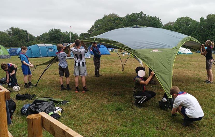 Members of the 1st Killingworth Scouts putting up one of their new event shelters